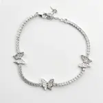 Sterling silver butterfly tennis bracelet with clasp, top view