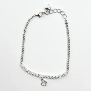 Sterling silver tennis bracelet with cubic zirconia and charm, top view