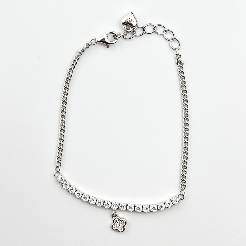 Sterling silver tennis bracelet with cubic zirconia and charm, top view