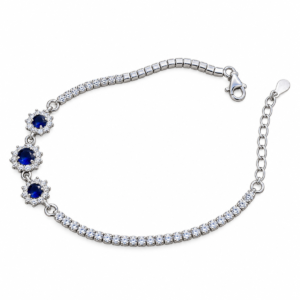 Sterling silver tennis bracelet with sapphire crystals and floral clasp, top view