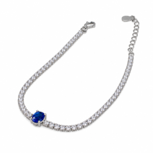 Sterling silver tennis bracelet with blue sapphire clasp, top view