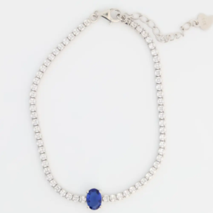 Sterling silver tennis bracelet with blue sapphire clasp, top view